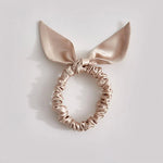 Thin caramel-colored silk scrunchie made from 25-momme mulberry silk