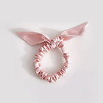 Thin pink bow scrunchie made of 25 mommes of mulberry silk