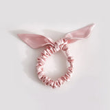 Thin pink bow scrunchie made of 25 mommes of mulberry silk