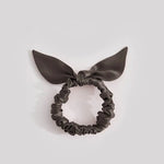 Thin anthracite-colored silk scrunchie with a bow, made from 25 mommes of mulberry silk
