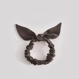 Thin anthracite-colored silk scrunchie with a bow, made from 25 mommes of mulberry silk