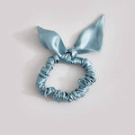 Thin light blue silk scrunchie with a bow, made from 25 mommes of mulberry silk